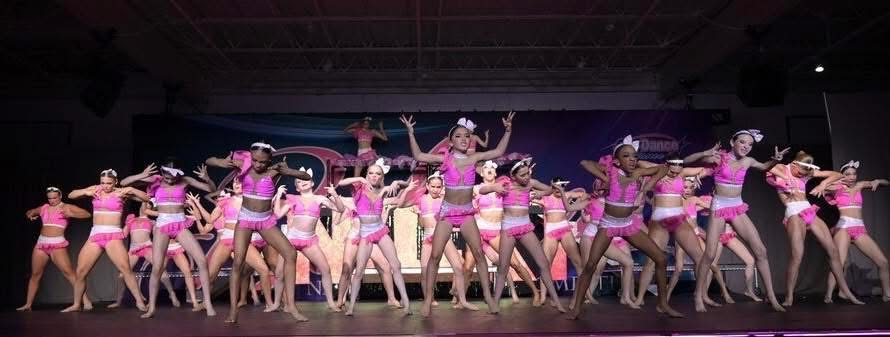 Kay's Act II competitive team performing on stage
